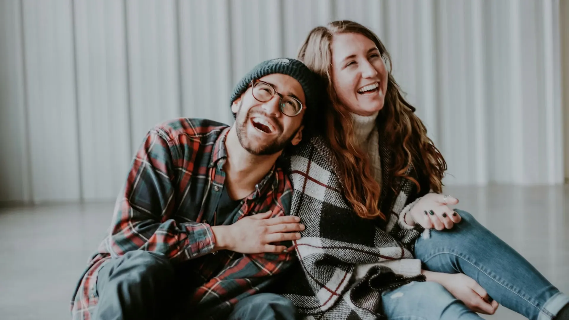 Two people laughing together